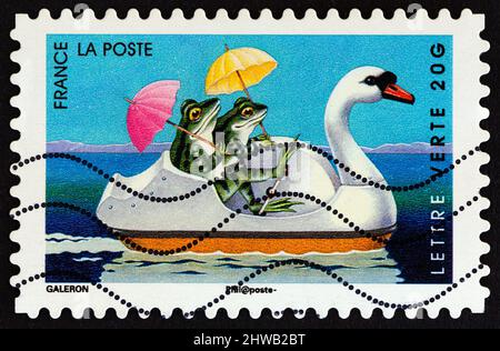 FRANCE - CIRCA 2014: A stamp printed in France from the 'Holiday' issue shows frogs, circa 2014. Stock Photo