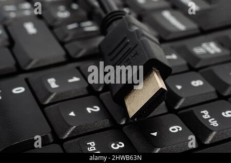 Close-up of a black HDMI cable. Cable for communication and high-speed Internet Stock Photo