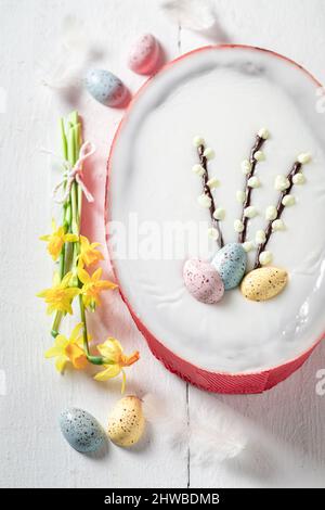 Sweet Easter cake made with yellow daffodils Easter chocolate cake with eggs. Stock Photo