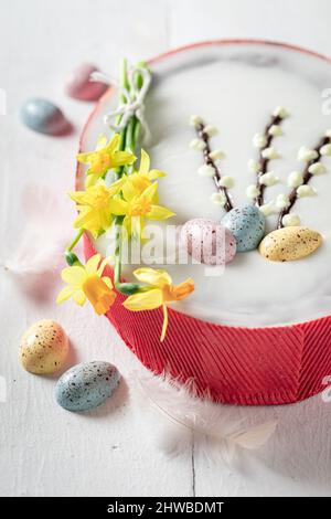 Delicious Easter cake made with yellow daffodils Easter chocolate cake with eggs. Stock Photo