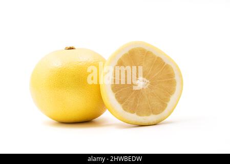 Isolated Yellow grapefruits. Whole Yellow grapefruit and slice of fresh grapefruit isolated on white background with clipping path Stock Photo