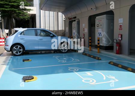 GWM EV charge station with ORA car, Siam Square, Bangkok , Thailand. Stock Photo