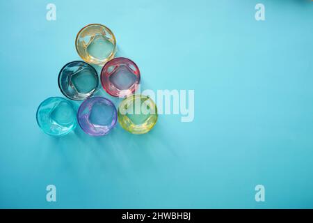 top view of empty drinking glasses on blue background  Stock Photo