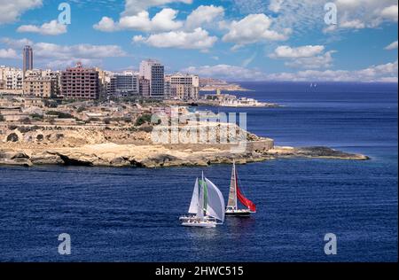 Valletta, Malta. Sailing Past Dragut Point, Entrance to Marsamxett Harbor and Sliema Creek.  From this point Turkish artillery bombarded Fort St. Elmo in the siege of 1565.  The point now holds the remains of Fort Tigne. Stock Photo