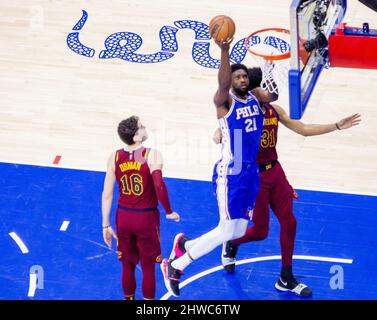 Philadelphia 76ers' Joel Embiid (21) shoots over Brooklyn Nets' Nic ...