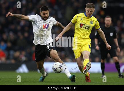London, England, 5th March 2022. Aleksandar Mitrović of Fulham and Scott Wharton of Blackburn Rovers challenge for the ball during the Sky Bet Championship match at Craven Cottage, London. Picture credit should read: Paul Terry / Sportimage Credit: Sportimage/Alamy Live News Stock Photo