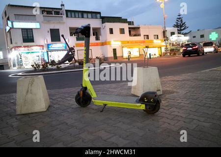 link rental hire scooter left on the pavement at night in playa blanca lanzarote canary islands spain Stock Photo