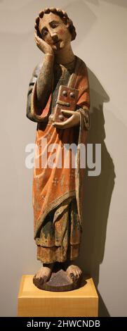 Calvary. Detail of St. John. Second half of the 13th century. Polychrome carving. Church of San Mamed from Tebongo, Asturies. Mares Museum. Barcelona, Stock Photo