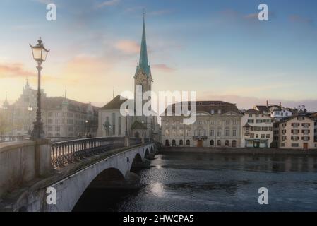 Fraumunster Church and Munsterbrucke Bridge at sunset - Zurich, Switzerland Stock Photo