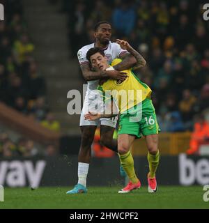 Norwich, UK. 05th Mar, 2022. Ivan Toney of Brentford fouls Mathias Normann of Norwich City during the Premier League match between Norwich City and Brentford at Carrow Road, Norwich, England on 5 March 2022. Photo by Ken Sparks. Editorial use only, license required for commercial use. No use in betting, games or a single club/league/player publications. Credit: UK Sports Pics Ltd/Alamy Live News Stock Photo