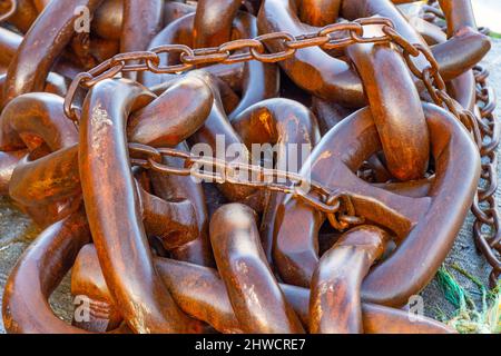 Rusting wet anchor chains Stock Photo