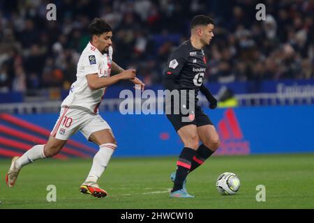 Hatem BEN ARFA of Lille and Lucas PAQUETA of Lyon during the French championship Ligue 1 football match between Olympique Lyonnais (Lyon) and LOSC Lille on February 27, 2022 at Groupama stadium in Decines-Charpieu near Lyon, France - Photo Romain Biard / Isports / DPPI Stock Photo
