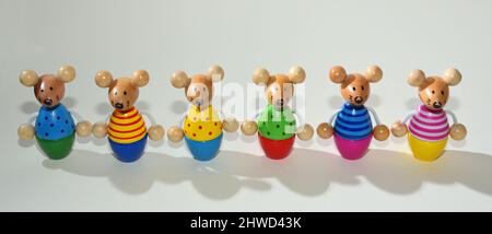 Mouse Skittles set  of six in a row  against plain background Stock Photo