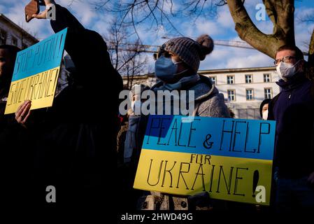 Berlin, Germany. 05th Mar, 2022. Germany, Berlin, March 05, 2022: Protesters can be seen as members of the Rundfunkchor Berlin (Berlin Radio Choir) sing in solidarity with Ukraine in front of the Russian Embassy in Central Berlin to protest against the ongoing Russian invasion of Ukraine. (Photo by Jan Scheunert/Sipa USA) Credit: Sipa USA/Alamy Live News Stock Photo