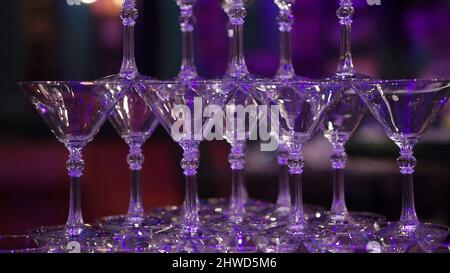 Champagne glass pyramid. Clip. Pyramid of glasses of wine, champagne, tower of champagne. Stock Photo