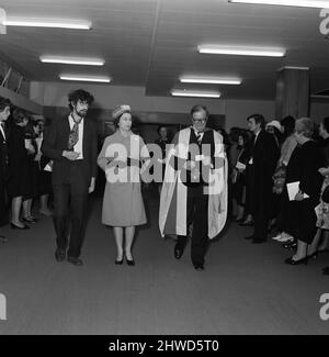 Queen Elizabeth II meets Piers Corbyn. Picture shows Piers Corbyn (left) Queen Elizabeth II and Lord Penny (right)  The Queen and The Duke of Edinburgh visit Imperial College of Science and Technology, to open the new College Block and Libraries Building.  Picture taken 27th November 1969.  22 year old Piers Corbyn (left in beard, and glasses) ,who is President of the Students Union, is presented to H.M The Queen. He met her twice, on the first presentation he was unable to present to the Queen with three letters.  He informed the Duke of Edinburgh he had some letters for The Queen, but the Du Stock Photo