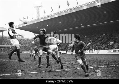 Sheffield Wednesday v Scunthorpe United FA Cup fourth round match at Hillsborough January 1970.   Scunthorpe's Don Welbourne rises to head a corner from Wednesday's Tony Coleman    Final score:  Sheffield Wednesday 1-2 Scunthorpe United Stock Photo