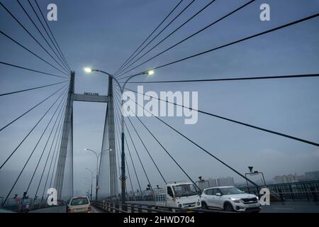 Howrah, West Bengal, India - 4th August 2020 : 2nd Hoogly bridge, vidyasagar setu at blue hour. Monsoon stock image. Stock Photo