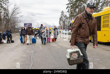 IRPIN, UKRAINE - Mar. 05, 2022: War of Russia against Ukraine. Women, old people and children evacuated from Irpin town was transferd to Kyiv by Kyiv territorial defense battalion. War refugees in Ukraine Credit: Mykhailo Palinchak/Alamy Live News Stock Photo