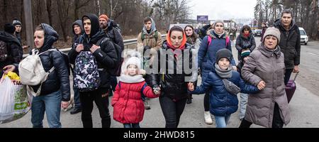 IRPIN, UKRAINE - Mar. 05, 2022: War of Russia against Ukraine. Women, old people and children evacuated from Irpin town was transferd to Kyiv by Kyiv territorial defense battalion. War refugees in Ukraine Credit: Mykhailo Palinchak/Alamy Live News Stock Photo