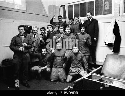 Sheffield Wednesday v Scunthorpe United FA Cup fourth round match at Hillsborough January 1970.   Celebrations in Scunthorpe dressing room with winning goal scorer at back (arm raised in salute)     Final score:  Sheffield Wednesday 1-2 Scunthorpe United Stock Photo