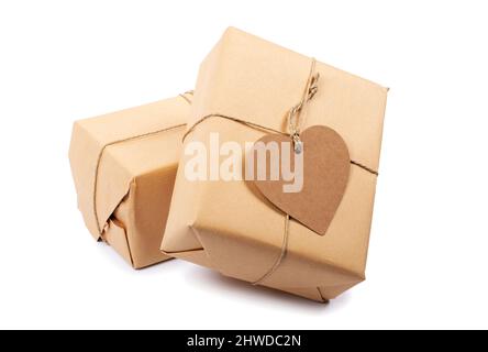 Gift boxes with blank heart shaped label isolated on white Stock Photo