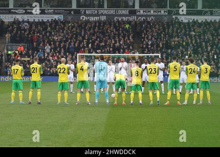Norwich, UK. 05th Mar, 2022. Both sets of players applaud in solidarity with Ukraine during the Premier League match between Norwich City and Brentford at Carrow Road, Norwich, England on 5 March 2022. Photo by Ken Sparks. Editorial use only, license required for commercial use. No use in betting, games or a single club/league/player publications. Credit: UK Sports Pics Ltd/Alamy Live News Stock Photo