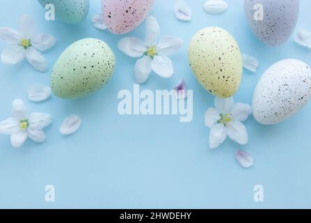 Top view of colorful easter eggs on blue background Stock Photo