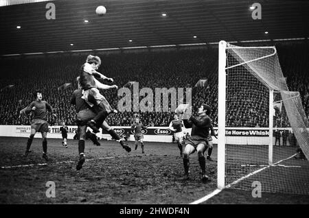 Sheffield Wednesday v Scunthorpe United FA Cup fourth round match at Hillsborough January 1970.   Wednesday's Jack Whitham rises high but fails to connect with his head as Scunthorpe's Geoff Barnard clears      Final score:  Sheffield Wednesday 1-2 Scunthorpe United Stock Photo