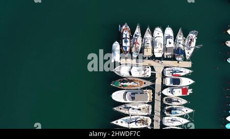 Aerial view of large and small yachts and sailboats moored at the quay. Top view of Boats in Procida, Italy Stock Photo