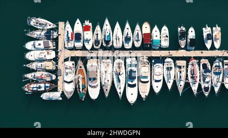 Aerial view of large and small yachts and sailboats moored at the quay. Top view of Boats in Procida, Italy Stock Photo