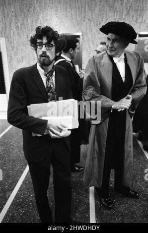 Queen Elizabeth II meets Piers Corbyn. Piers Corbyn waiting for the Queen's arrival. Man on the right is not named  Story for the picture set is :  The Queen and The Duke of Edinburgh visit Imperial College of Science and Technology, to open the new College Block and Libraries Building.  Picture taken 27th November 1969.  22 year old Piers Corbyn (in beard, and glasses) ,who is President of the Students Union, is presented to H.M The Queen. He met her twice, on the first presentation he was unable to present to the Queen with three letters.  He informed the Duke of Edinburgh he had some letter Stock Photo