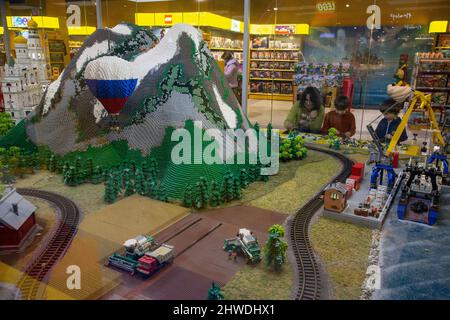 Moscow, Russia. 5th of March, 2022 A family collects a Lego set in the Hamleys children's toy store at the Moscow's Central Children's Store on Lubyanka, Russia Stock Photo