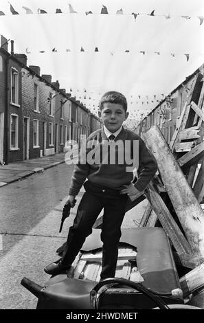 Street party in Balkan Street, Belfast. The party was organised after the street was hit by riot just a week ago after fighting broke out following the army discovering a cache of arms in the road. The party was organised for the children who had to stay in their homes because of a curfew imposed during the riots. 12th July 1970. Stock Photo