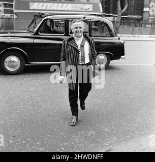 Leo Abse, Labour MP for Pontypool, arrives at the House of Commons wearing his budget day clothes, a suit made of Welsh tweed. 15th April 1969. Stock Photo