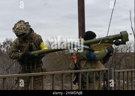 Ukrainian soldiers prepare an anti-air missile as air raids intensify. Refugees flee Irpin, and Ukrainian forces continue to fortify the city, as Russian forces attempt to advance on the Ukrainian capital city of Kyiv on March 5th, 2022 in Irpin, Ukraine. (Photo by Justin Yau/ Credit: Sipa USA/Alamy Live News Stock Photo