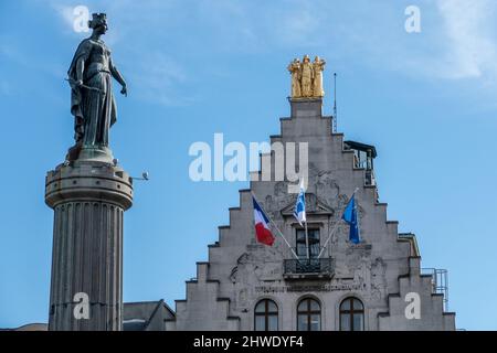 Lille, France, February 28, 2022. Column of Victory, Column of the Goddess with the flags of the La Voix du Nord facade Stock Photo