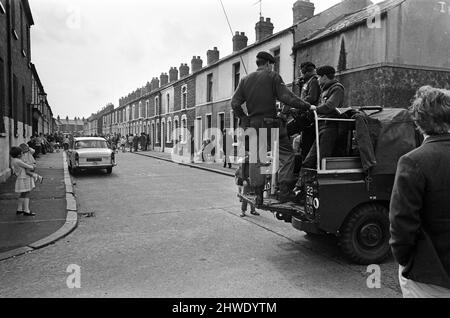 Street party in Balkan Street, Belfast. The party was organised after the street was hit by riot just a week ago after fighting broke out following the army discovering a cache of arms in the road. The party was organised for the children who had to stay in their homes because of a curfew imposed during the riots. 12th July 1970. Stock Photo