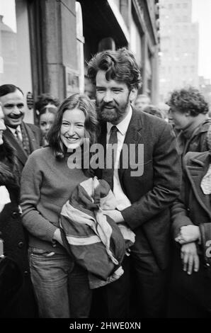 22 year old student Ann Warren climbed to the top of Rhodesia House, took down the rebel smith regime flag and replaced it with the Union Jack. At 5pm she took the Union Jack down and eventually came on to The Strand pavement for a press conference and a kiss from her boyfriend, Ian Middlehurst, who was one of the two men who spent a Sunday perched in the same position earlier in the month. Pictured, after the ordeal Ann is greeted by Ian beneath Rhodesia House, they have the Union Jack with them. 27th January 1969. Stock Photo