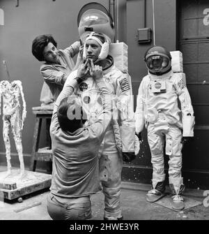 Madame Tussauds staff put the finishing touches to waxwork models of astronauts Neil Armstrong (front) and Buzz Aldrin ahead of display (starting 16th July), to commemorate the anticipated moon landing, Pictured Tuesday 15th July 1969. Our Picture Shows ... sculptor Jean Fraser assisted by David Tomkins. Stock Photo