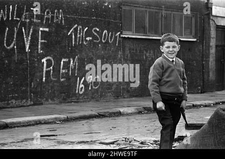 Street party in Balkan Street, Belfast. The party was organised after the street was hit by riot just a week ago after fighting broke out following the army discovering a cache of arms in the road. The party was organised for the children who had to stay in their homes because of a curfew imposed during the riots. 12th July 1970. Stock Photo