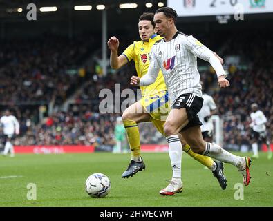 London, England, 5th March 2022.  Antonee Robinson of Fulham and Lewis Travis of Blackburn Rovers challenge for the ball during the Sky Bet Championship match at Craven Cottage, London. Picture credit should read: Paul Terry / Sportimage Credit: Sportimage/Alamy Live News Stock Photo