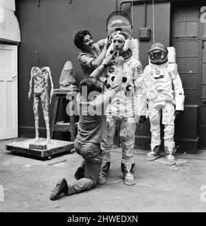 Madame Tussauds staff put the finishing touches to waxwork models of astronauts Neil Armstrong (front) and Buzz Aldrin ahead of display (starting 16th July), to commemorate the anticipated moon landing, Pictured Tuesday 15th July 1969. Our Picture Shows ... sculptor Jean Fraser assisted by David Tomkins.  NOTE : Pictures taken with a Hasselblad Data Camera, similar to two Cameras which will be taken to and left on the moon. Only the film magazines will be bought back, to reduce weight. Stock Photo