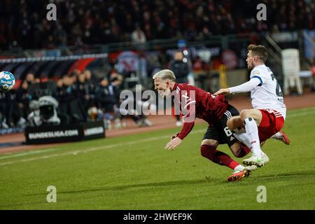 Nuremberg, Germany. 05th Mar, 2022. Soccer: 2. Bundesliga, 1. FC Nürnberg - Hamburger SV, Matchday 25, at Max-Morlock-Stadion, Hamburg's Miro Muheim (r) fouls Nuremberg's Lino Tempelmann. Credit: Löb Daniel/dpa/Alamy Live News Stock Photo