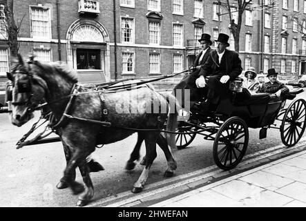 Pontypool MP Leo Abse and his wife arriving at the Angel Hotel, Cardiff where he is opening the Cardiff Antiques Fair at the hotel. They are wearing Edwardian clothing and arrive in a horse drawn open carriage. 13th April 1970. Stock Photo