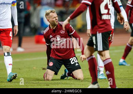 Nuremberg, Germany. 05th Mar, 2022. Soccer: 2. Bundesliga, 1. FC Nürnberg - Hamburger SV, Matchday 25, at Max-Morlock-Stadion, Nürnberg's Pascal Köpke holds his calf because of a pain. Credit: Löb Daniel/dpa/Alamy Live News Stock Photo