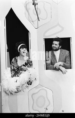 Rowan & Martin's Laugh-In, an American sketch comedy television program on the NBC television network, behind the scenes filming for series 2 episode 22, (aired Monday 3rd March 1969), in studio, Wednesday 15th January 1969. Our picture shows ... Jo Anne Worley, series regular with James Garner. Stock Photo