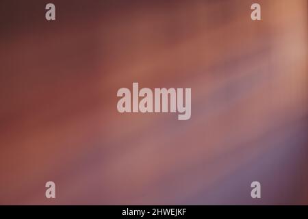 Abstract violet shadow on a wall from the window at sunset. Stock Photo