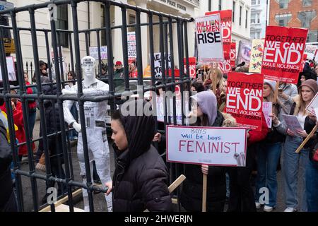 London, UK. 5th Mar 2022.  People take part in a Million Women Rise march outside New Scotland Yard in central London, ahead of International Women's Day. The march is in protest against men's violence against women, police violence, racism and misogyny.  Credit: Joao Daniel Pereira Stock Photo