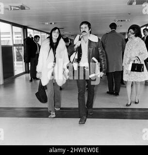 American pop singers Sonny and Cher on arrival at Heathrow Airport. 5th April 1969. Stock Photo